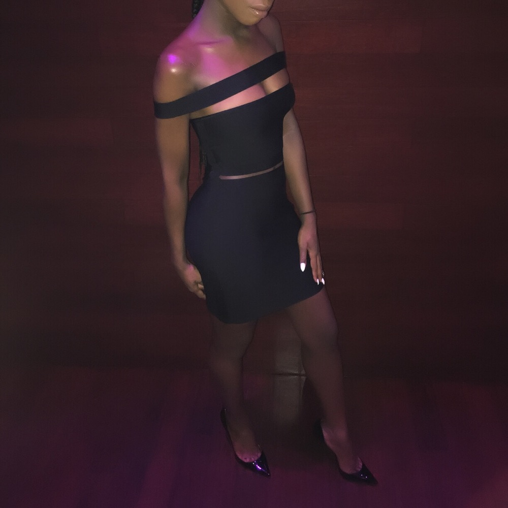 Black off the shoulder bandage dress.